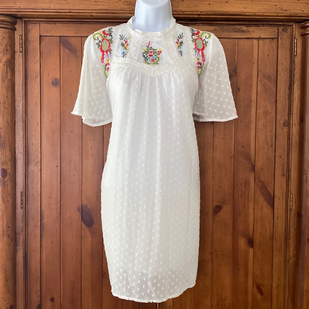 White Floral Embroidered Dress, has a dotted texture, with a floral embr…